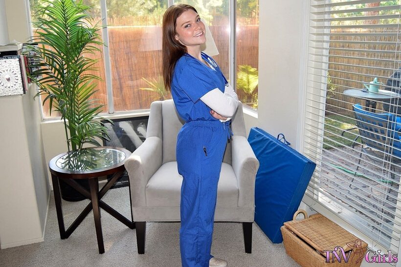 Image 4/10: Katerina strips out of her nurse uniform and poses nude at work