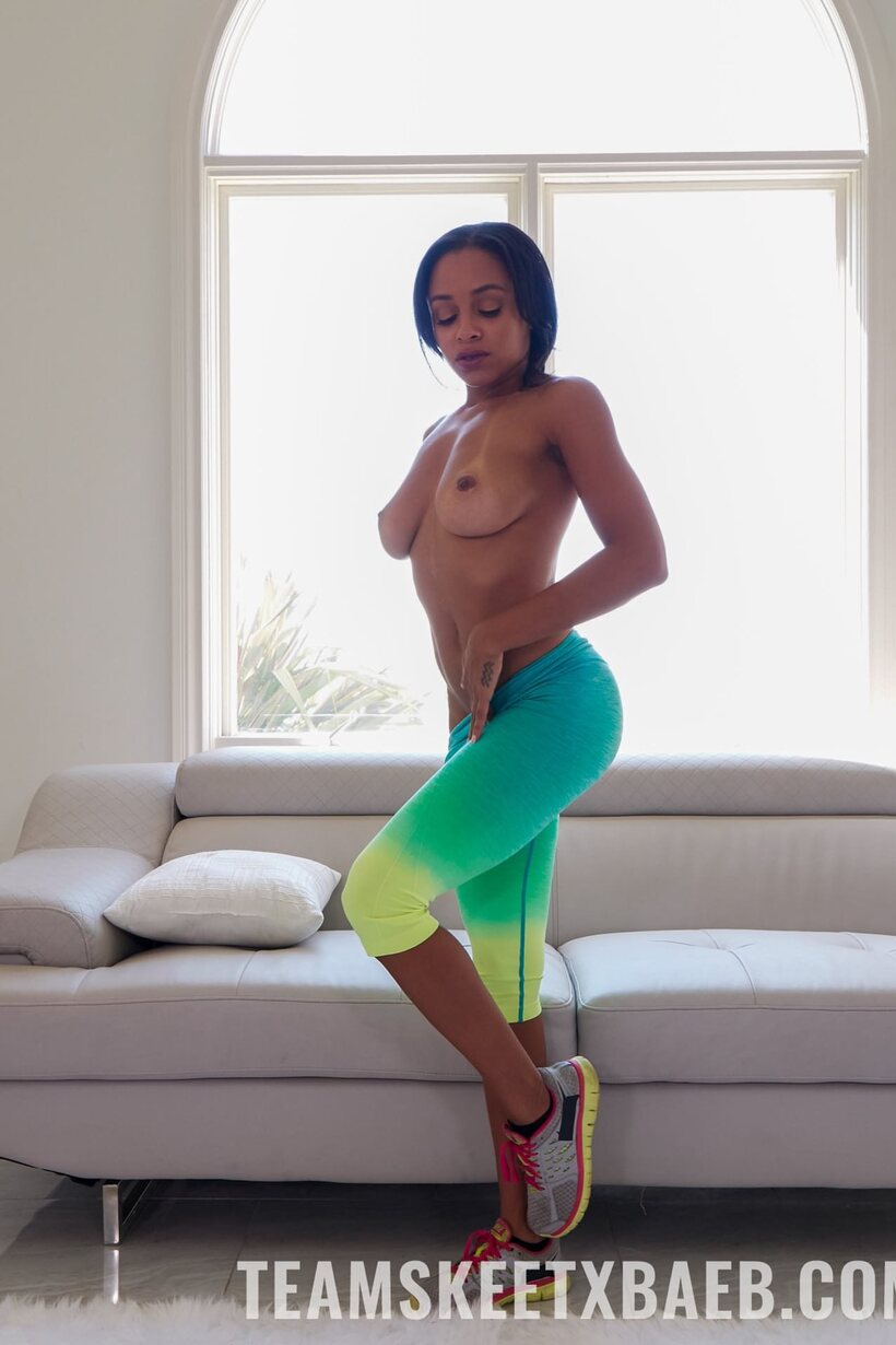 Image 6/20: Ebony Anya Ivy exposes her natural tits while undressing