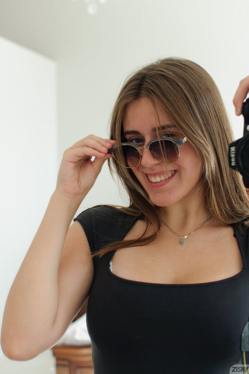 Amateur pic 1 from the set «Amateur girl up close: natural tits and feet in glasses»