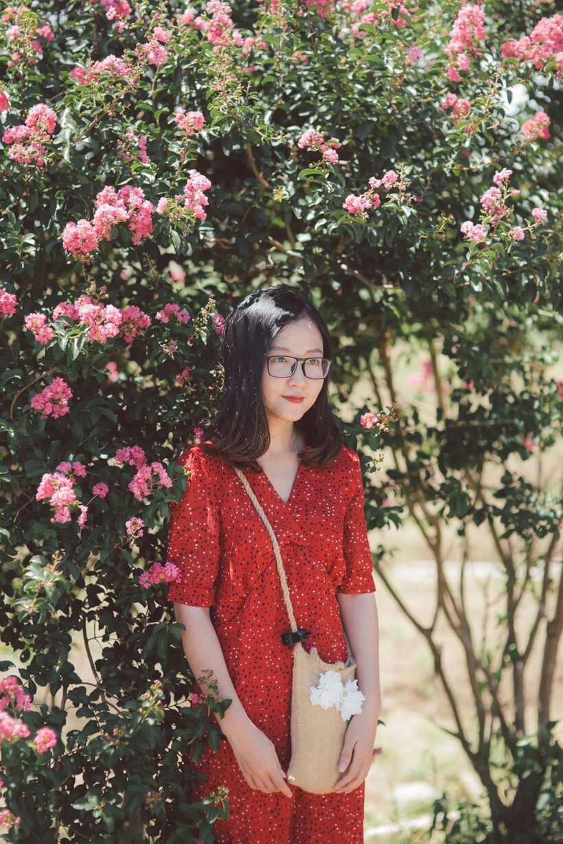Amateur nude photo 1 — Glasses on, an Asian babe poses outdoors in a red dress