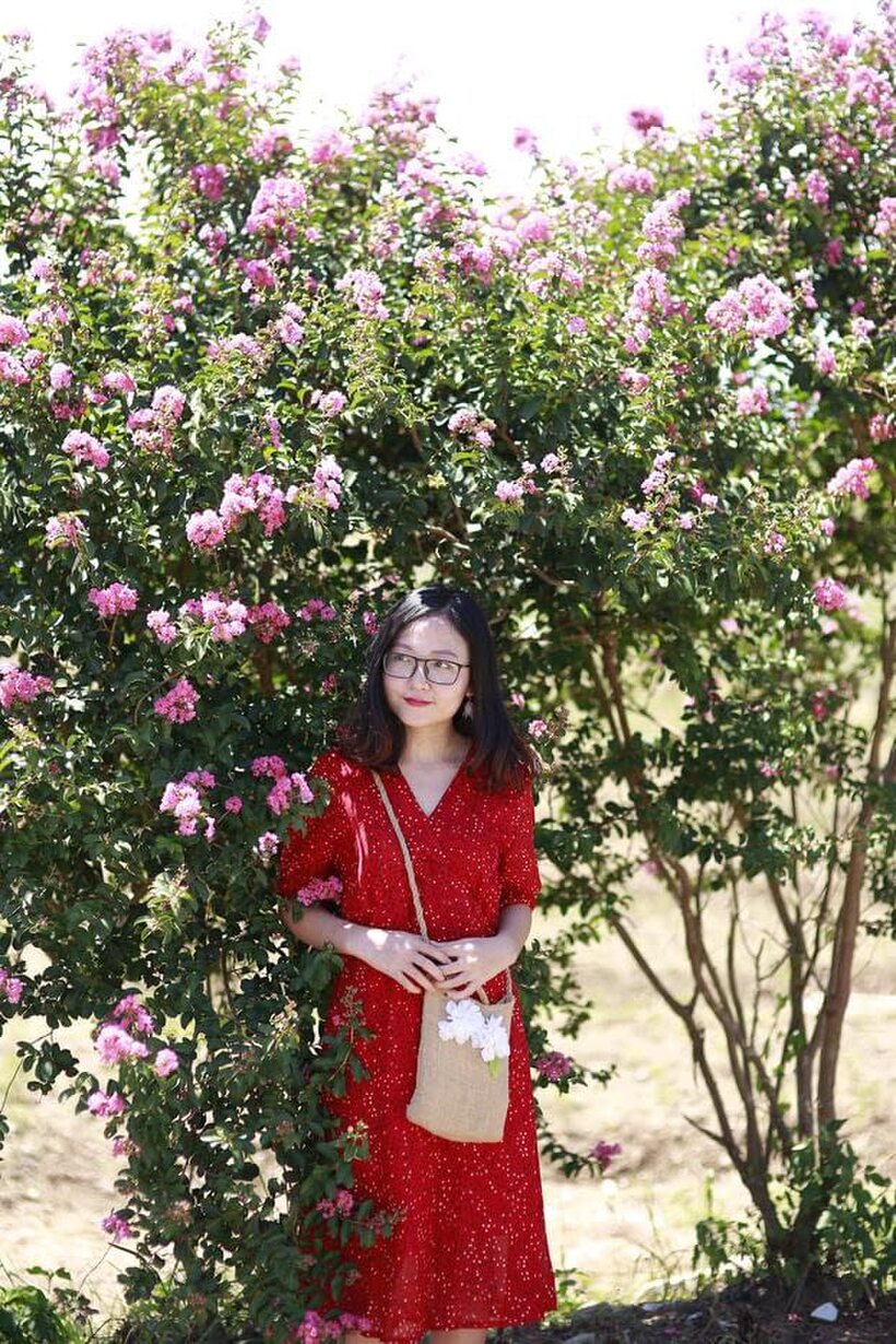 Amateur nude photo 3 — Glasses on, an Asian babe poses outdoors in a red dress