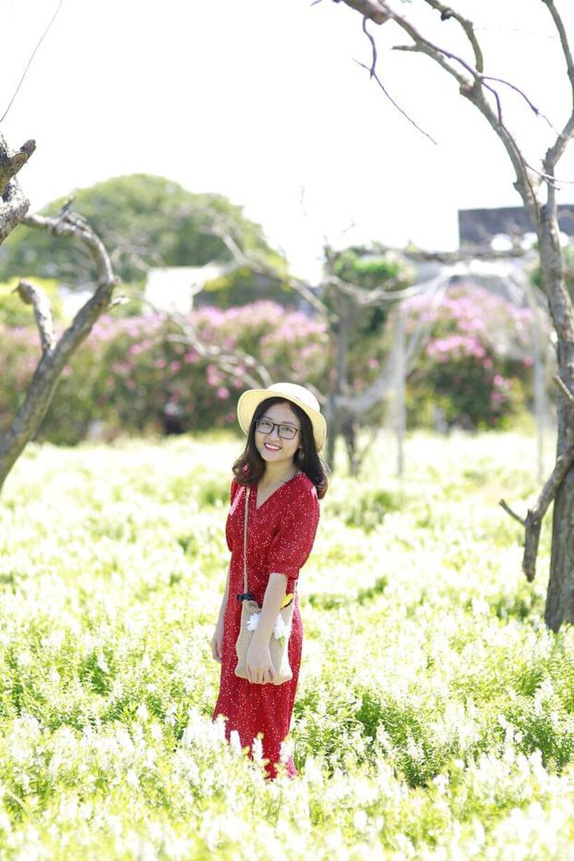 Photo 17 — Glasses on, an Asian babe poses outdoors in a red dress