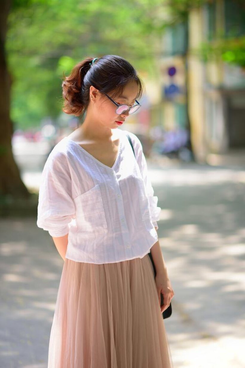 Amateur nude photo 20 — Glasses on, an Asian babe poses outdoors in a red dress