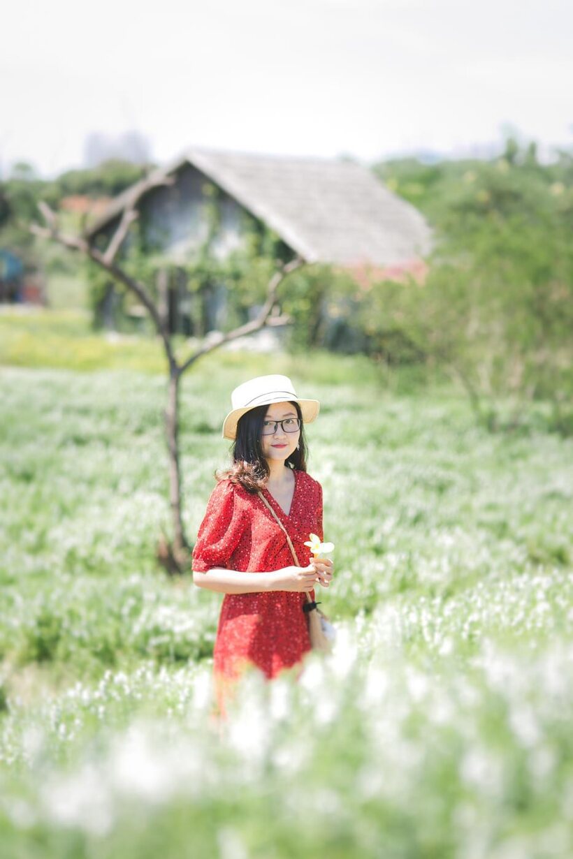 Photo 21 — Glasses on, an Asian babe poses outdoors in a red dress