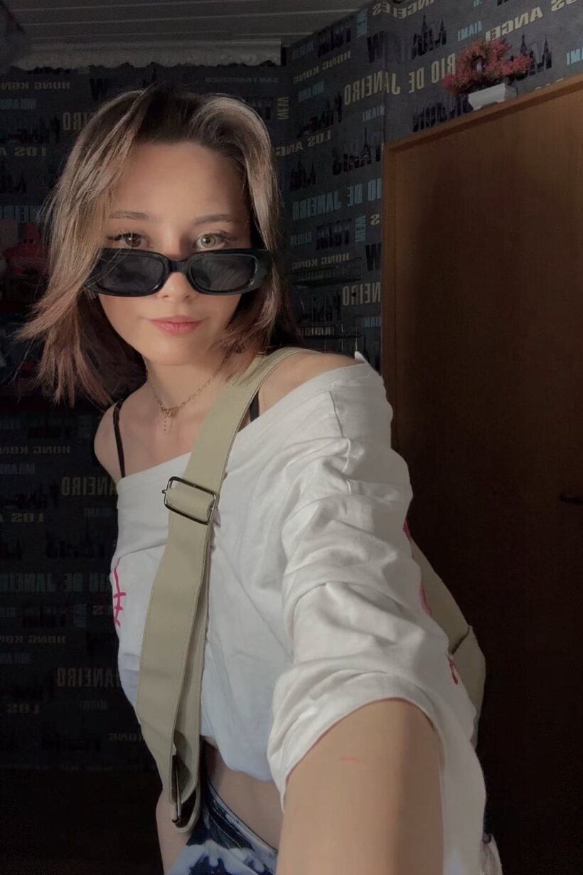 Schoolgirl taking selfies outdoors (shot 15)