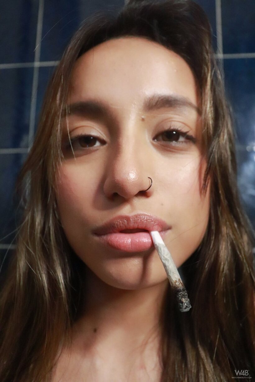 Camila Luna smokes and shows off her boobs and booty (shot 12)