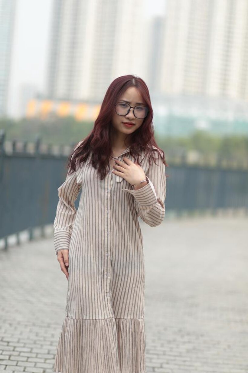 Image 20/21: Beautiful girl in a dress shows her body in public