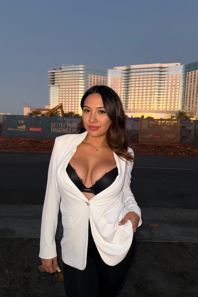 Image 13/20: Curvy girl in black lace lingerie removes her blazer and poses