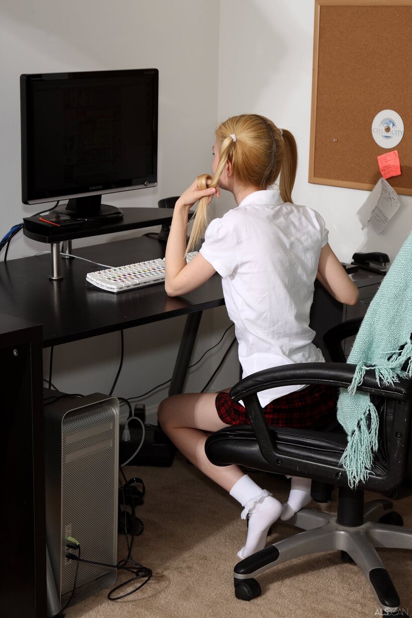Image 1/20: In the chair, Kennedy Kressler stretches her tight pussy with a dildo