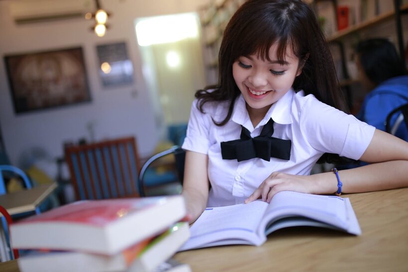 Photo 7 — Asian girl strips out of her skirt and poses naked