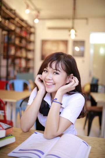 Asian girl strips out of her skirt and poses naked