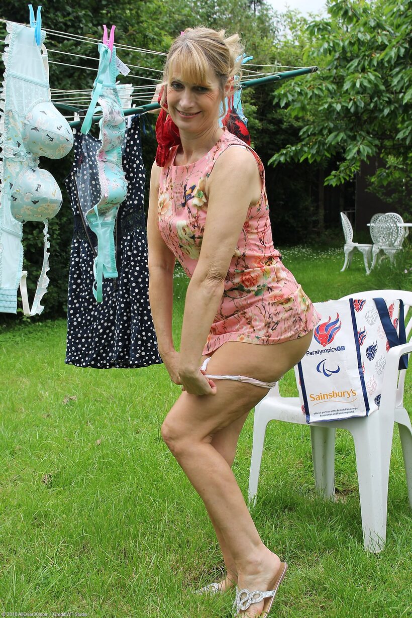 Image 4/20: Jane B slips out of her dress and spreads her love hole
