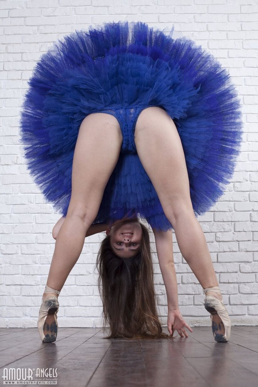 Amateur pic 4 from the set «Amateur girl shows her tiny tits and legs while bending over»