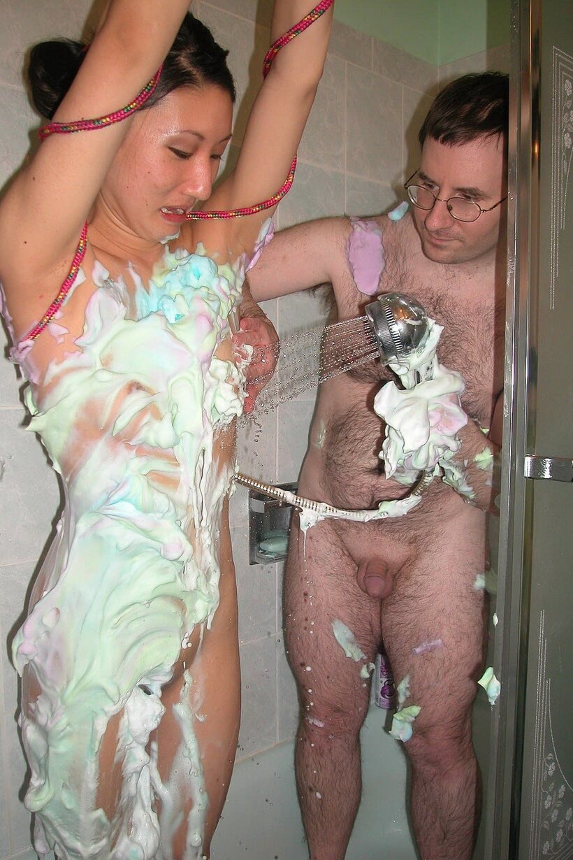 Image 18/21: Kiana Li lathers her petite naked body in foamy soap