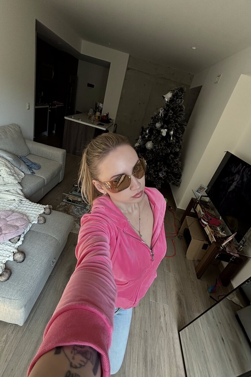 Photo 10 — Blonde amateur snaps selfies all day while showing off her curves
