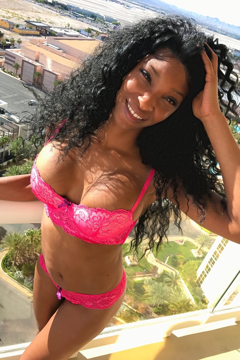 Flaunting her big tits, this hot ebony babe models sexy lingerie (shot 10)