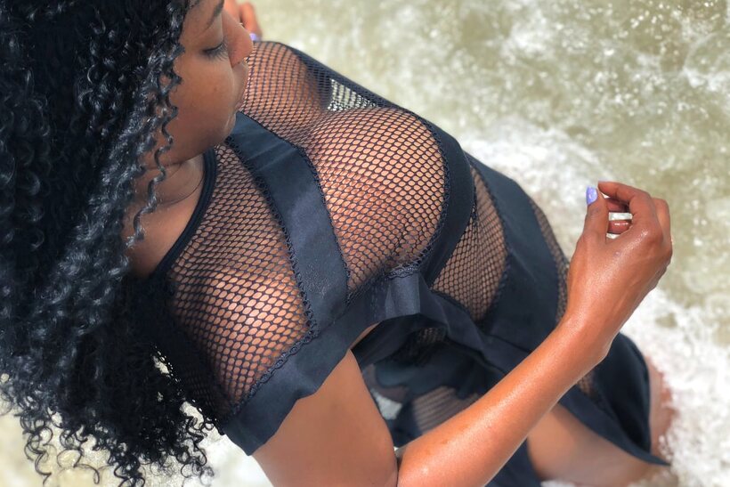 Flaunting her big tits, this hot ebony babe models sexy lingerie (shot 19)