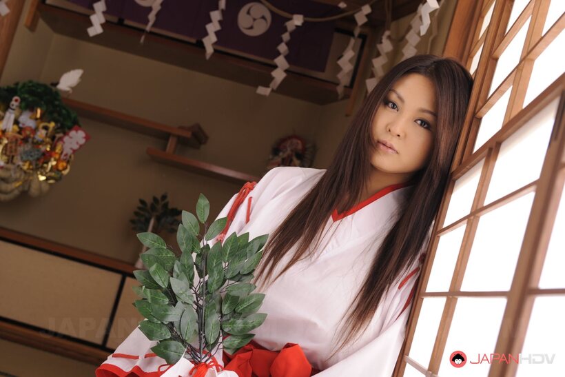Photo 3 — Brunette Airi Ai poses with her big tits on display