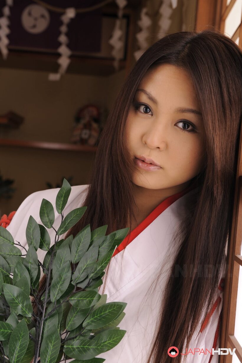 Brunette Airi Ai poses with her big tits on display, photo 4 of 15