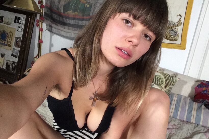 Photo 6 — Tattooed girl gets naked in bed