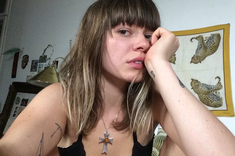 Tattooed girl gets naked in bed (shot 7)