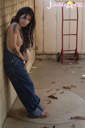 Joanna Angel lets her boobs spill from overalls before stripping