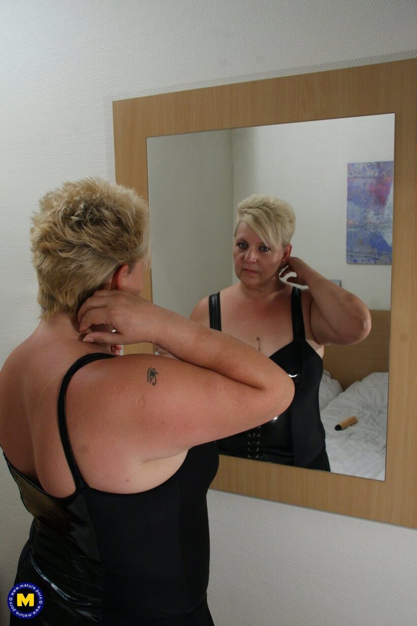 Image 1/20: Short blonde mature BBW spreads her pussy with a finger