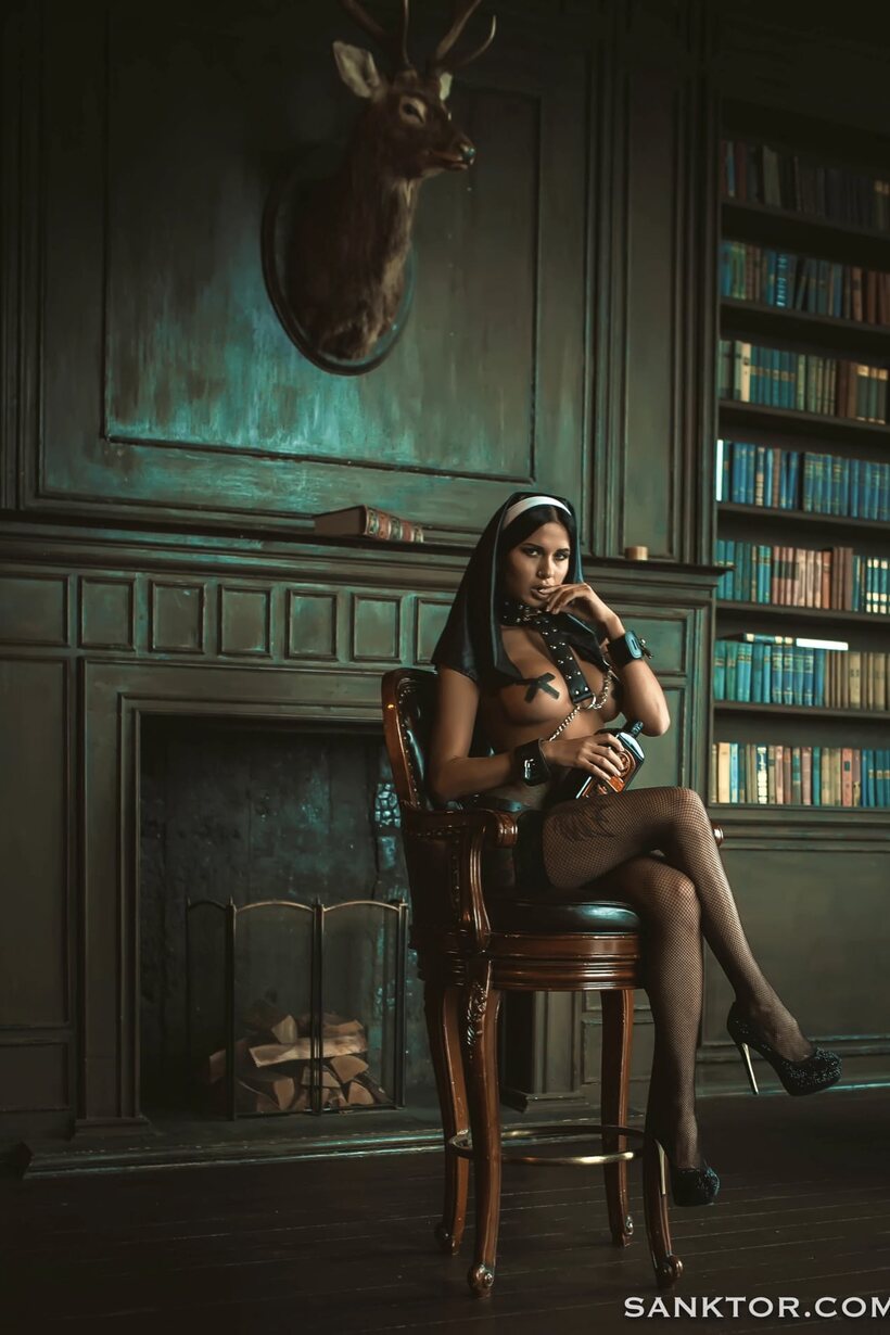 Image 2/21: Smoking in a nun outfit, Lina Melton shows off her curves