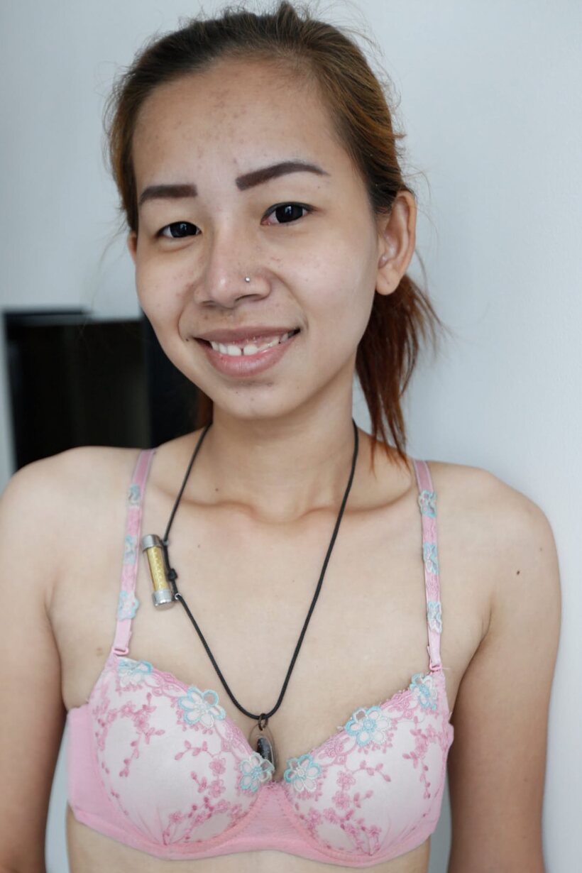 Petite girl poses with her small tits on display in jeans (shot 6)