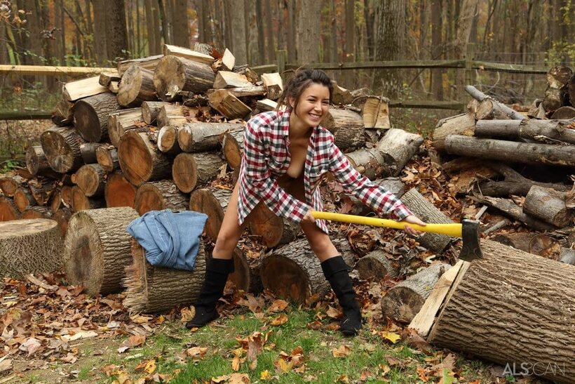 Daisy Summers nude photo 6 — Daisy Haze strips down to boots while chopping wood outdoors