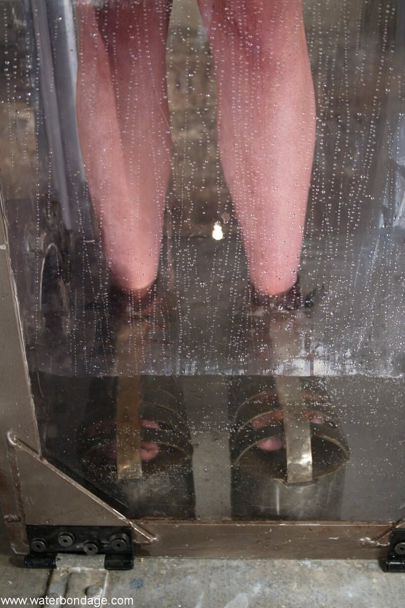 Jessica Sexin nude photo 1 — Jessica Sexin is held underwater inside a glass bondage box
