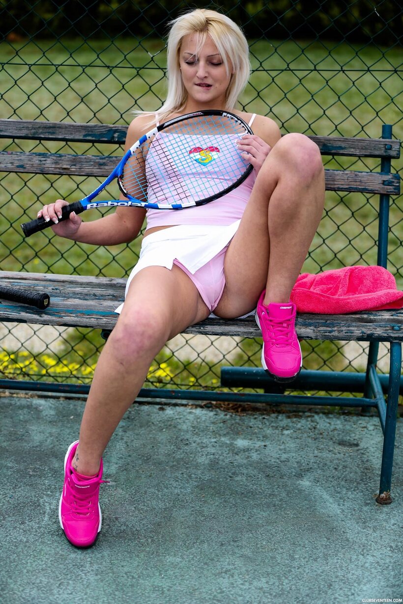 Photo 11 — Katy E flashes her small tits and grinds her twat on the tennis court