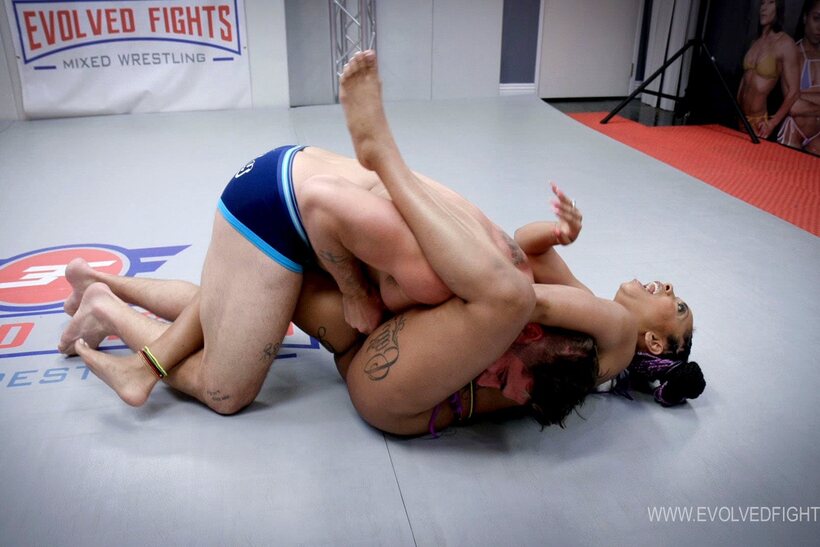 Photo 2 — Cali Caliente blows a man hard while grappling with him in the gym