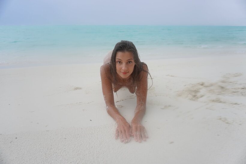 Melena Tara nude photo 1 — Melena Tara goes nude on the beach, letting sand coat her body