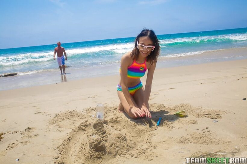 Image 5/16: Brad Newman lifts Jasmine Grey from the beach for a cock pounding