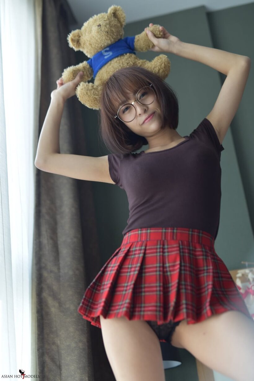 In a miniskirt and panties, pretty Asian teen shows off her ass, photo 10 of 20