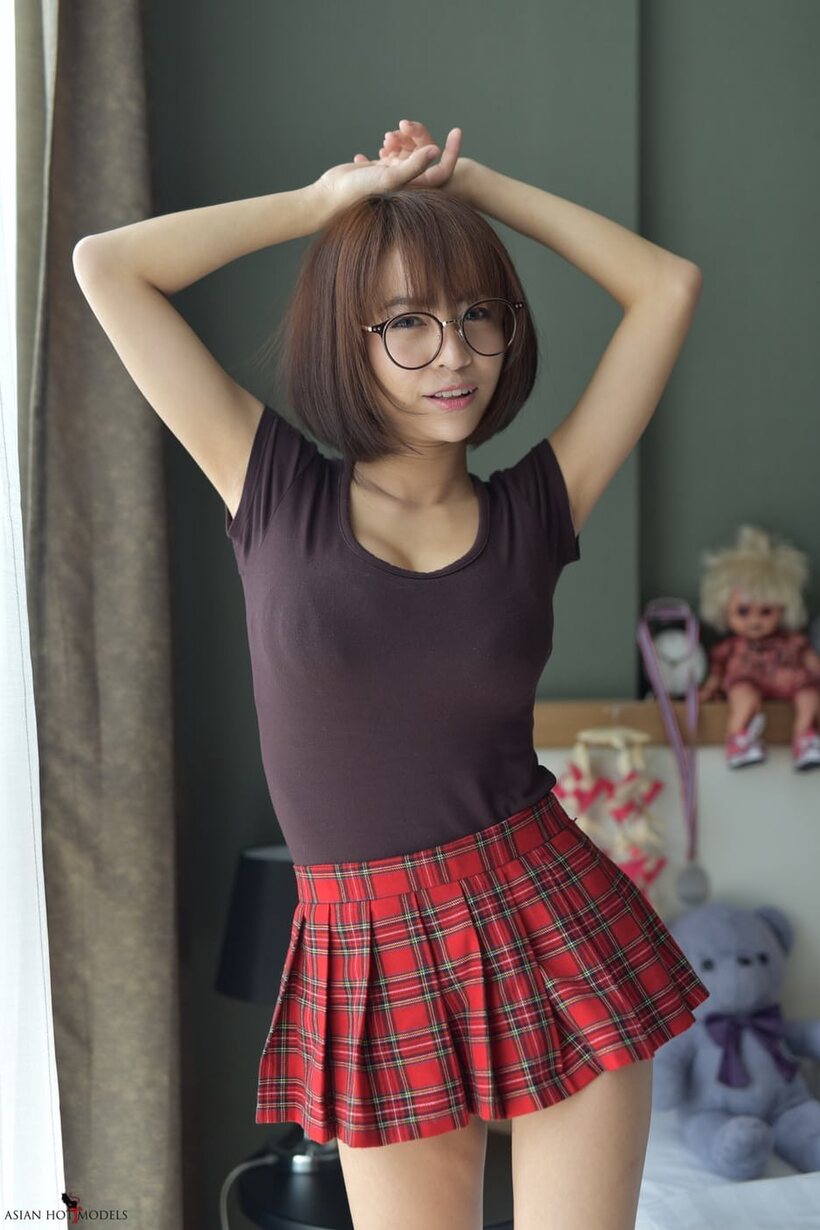 Image 12/20: In a miniskirt and panties, pretty Asian teen shows off her ass