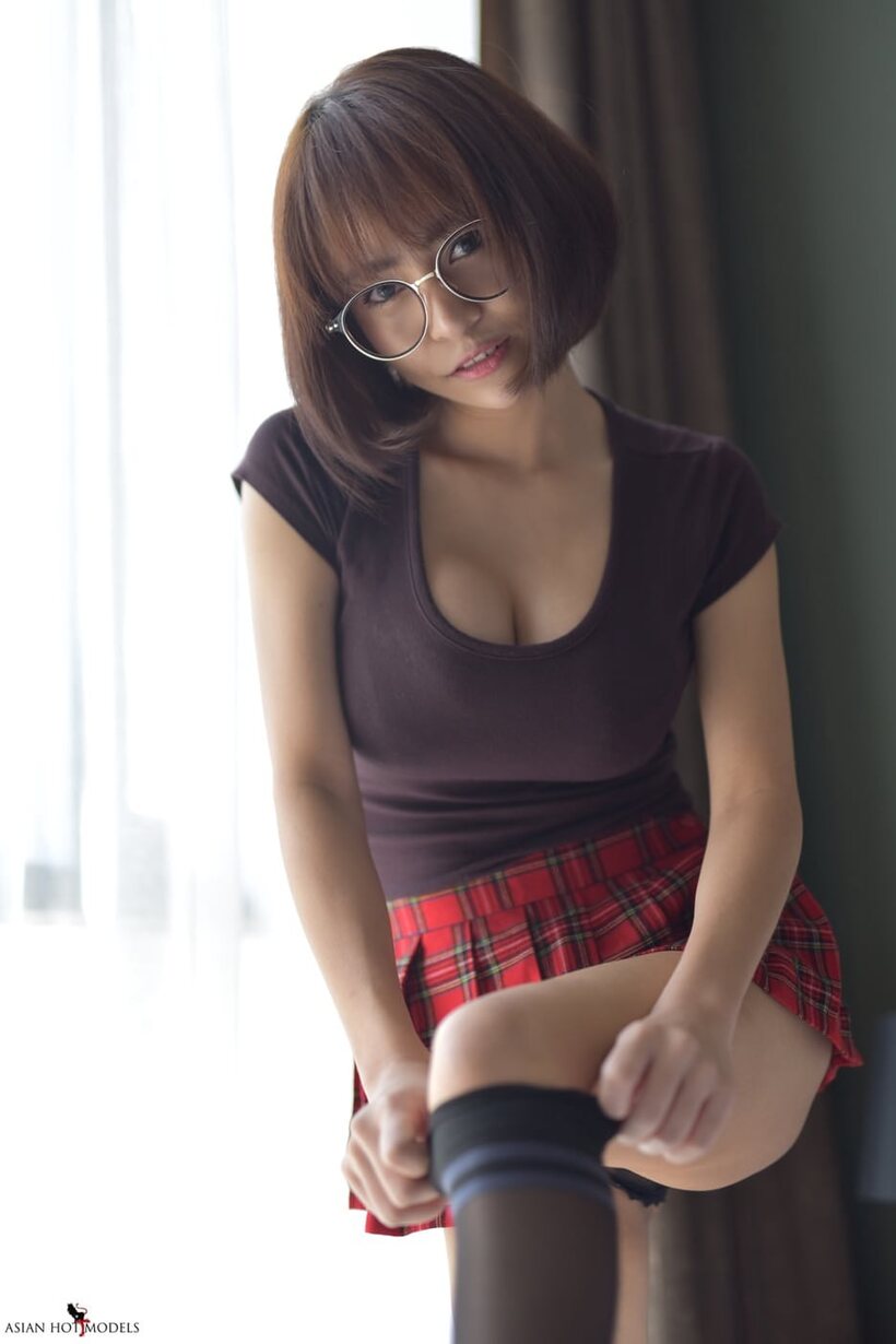 Photo 20 — In a miniskirt and panties, pretty Asian teen shows off her ass