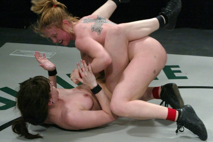Feet locked together as Dee Williams and Dana DeArmond wrestle naked, photo 12 of 21