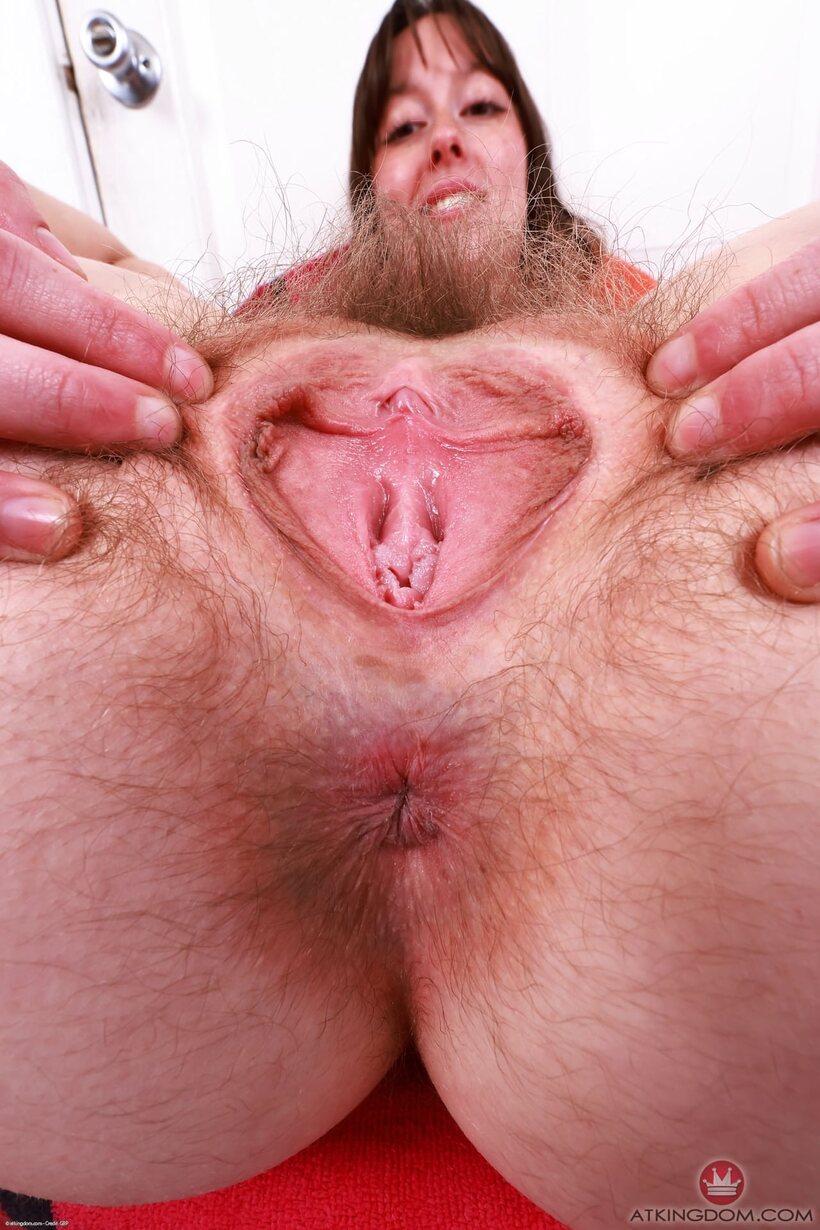 Photo 17 — Petite amateur opens her hairy pussy after taking off her dress