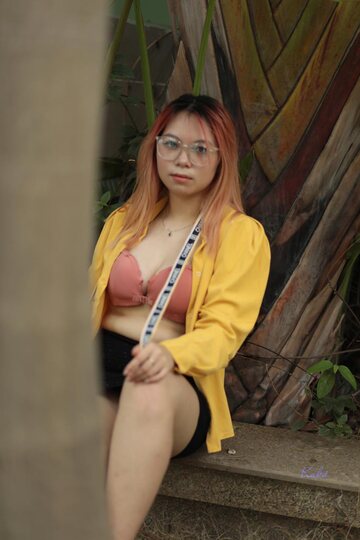 Redhead girl exposes her big tits outdoors