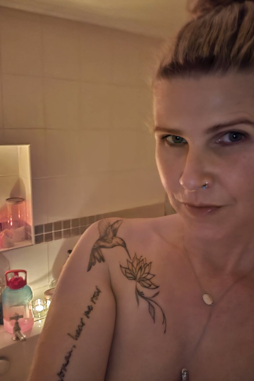 MILF gets naked in the bath (shot 1)