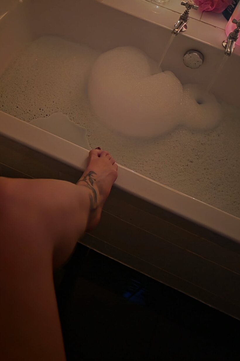MILF gets naked in the bath (shot 8)