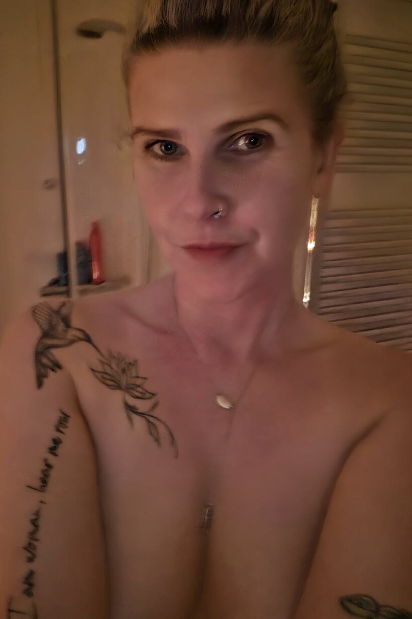 MILF gets naked in the bath (shot 9)