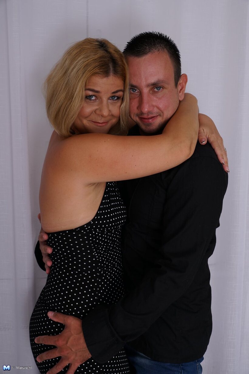After cards, overweight blonde fucks her younger lover in bed, photo 2 of 16