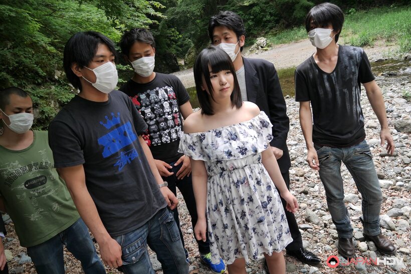 Tsuna Kimura blows a group of boys on rocky outdoor ground, photo 1 of 15