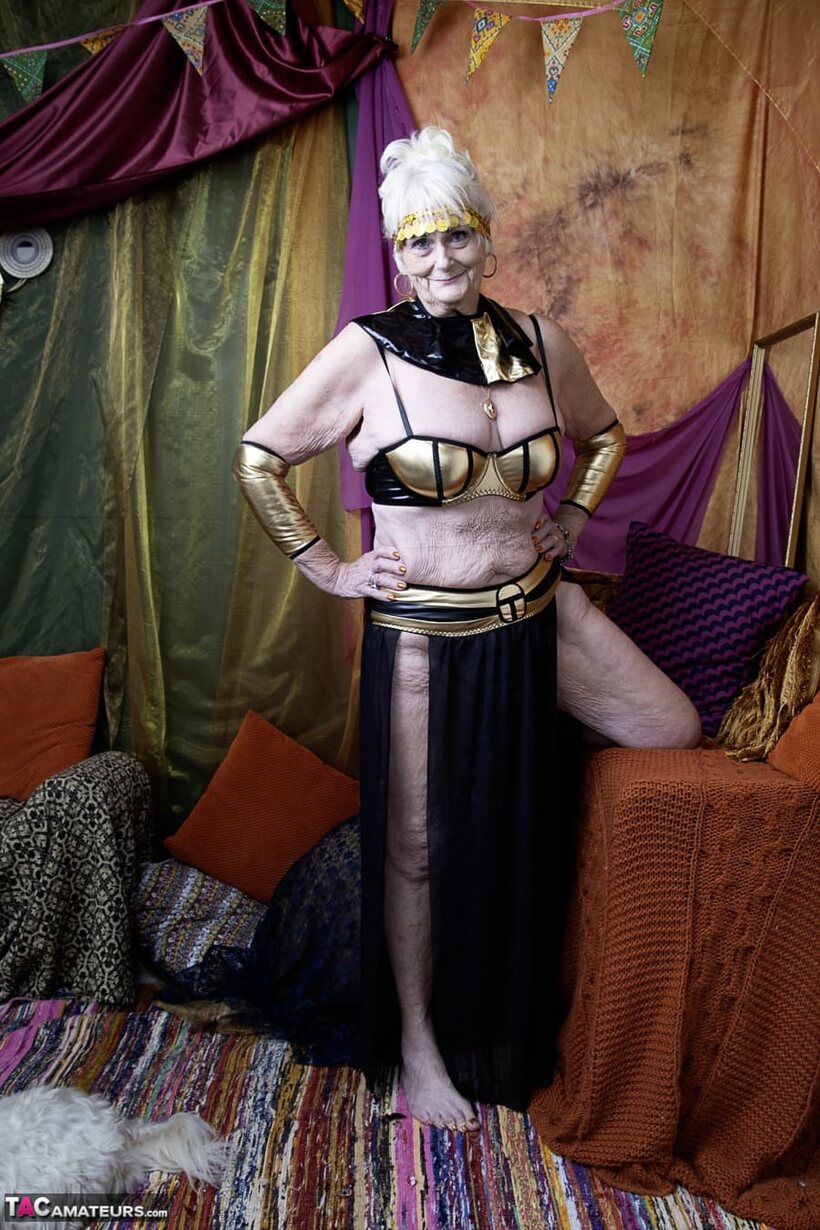 Photo 3 — Solo modelling shows an older blonde woman’s saggy tits and curves