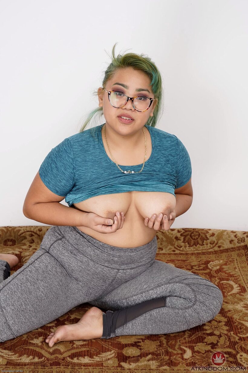 Chubby girl shows off her big tits and pussy in glasses (shot 8)