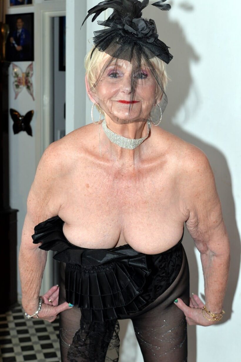 Amateur nude photo 2 — Blonde granny slips out of black lingerie, exposing her big natural tits