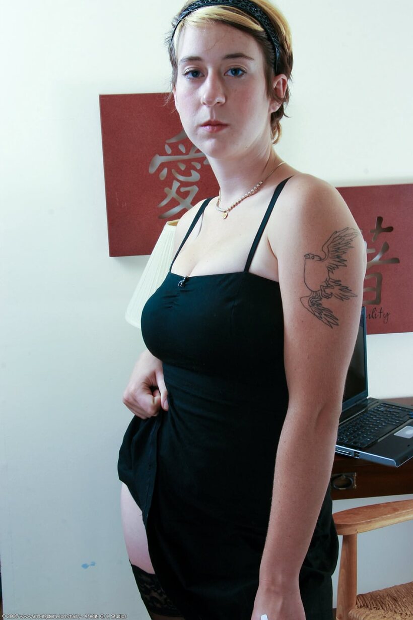 Image 8/21: Clothed girl poses with her hairy pussy on display in glasses